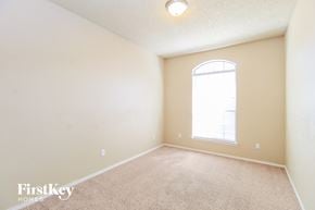 Arlington house for rent - a spacious room with carpet and a large window