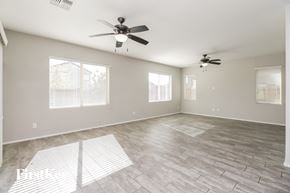 San Tan Valley house for rent - the living room of an empty home with a ceiling fan
