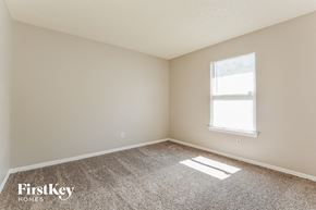 Deltona house for rent - a bedroom with carpet and a window