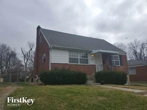 Cincinnati house for rent - A brick house with a white door and windows.