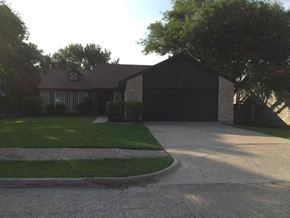 Forney house for rent - A house with a driveway and a garage.