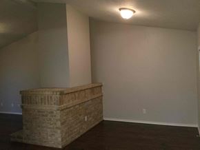 Forney house for rent - A room with a stone ledge and a light on the ceiling.