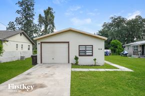 Saint Cloud house for rent - a small white house with a garage and a driveway