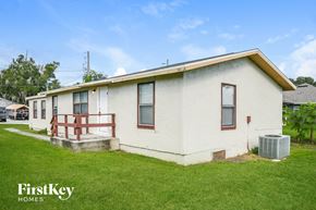 Saint Cloud house for rent - an old with a porch and a grass yard