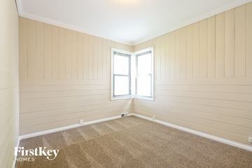 Winthrop Harbor house for rent - the living room of a home with a carpet and a window