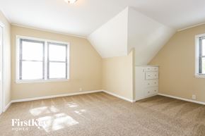 Winthrop Harbor house for rent - a bedroom with a dresser and a window