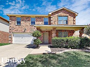 Anna house for rent - the front of a brick house with a white garage door