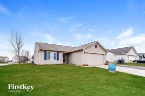 Bargersville house for rent - a house with a lawn and a blue sign in front of it