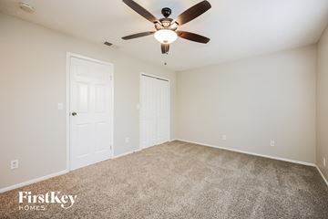 Cape Coral house for rent - the spacious living room with ceiling fan and carpet