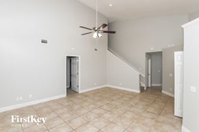 Rockledge house for rent - a living room with a ceiling fan and a tiled floor