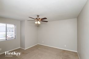Rockledge house for rent - a bedroom with a ceiling fan and a window