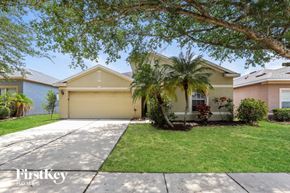 Seffner house for rent - a home with a driveway and a palm tree