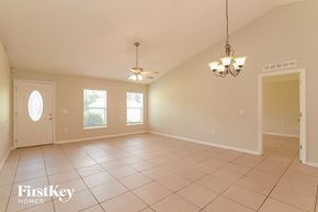 Poinciana house for rent - the living room and dining room are spacious and lighted by two ceiling fans