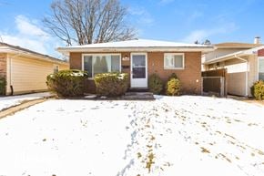 Calumet City house for rent - the front of a brick house in the snow