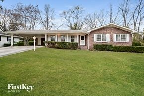 Conyers house for rent - a brick house with a lawn in front of it