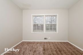 Conyers house for rent - a spacious room with carpet and a window