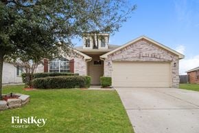 Anna house for rent - a white brick house with a garage and a driveway
