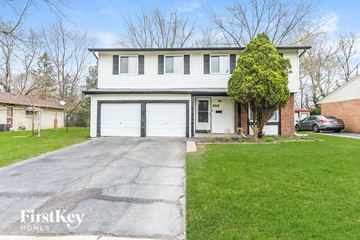 University Park house for rent - a white house with a driveway and a white garage door