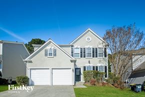 Woodstock house for rent - a white house with a white garage door