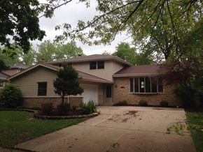 Matteson house for rent - a house with a driveway in front of it