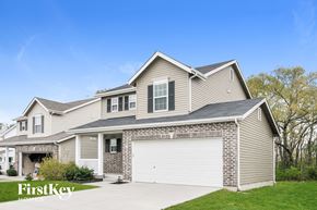 Wentzville house for rent - A house with a garage and a driveway is for sale by FirstKey Homes.