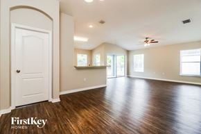 Auburndale house for rent - the living room and dining room of an empty house