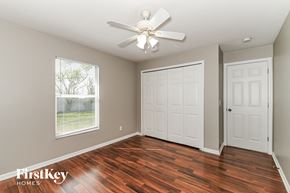 Cape Coral house for rent - the master bedroom has a hard wood floor and a ceiling fan