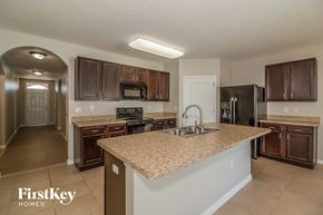 Davenport house for rent - a kitchen with a granite counter top and a sink