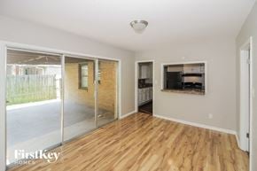 Memphis house for rent - a living room with a wood floor and a sliding glass door