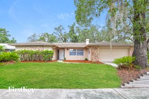 Winter Springs house for rent - A house with a well-maintained lawn and a clear sky above.