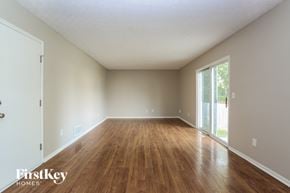 Galloway house for rent - an empty living room with wood floors and a sliding glass door