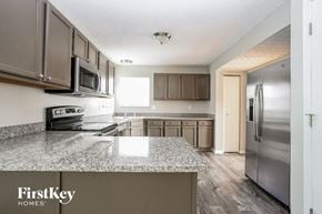 Galloway house for rent - a kitchen with stainless steel appliances and granite counter tops