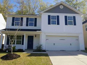 Fuquay Varina house for rent - A white house with a black door and windows.