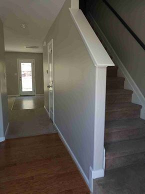 Fuquay Varina house for rent - A hallway with a staircase leading to the second floor.