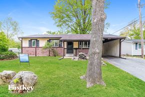 Florissant house for rent - A house with a tree in front of it.