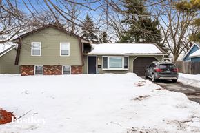 Matteson house for rent - a car parked in front of a house in the snow