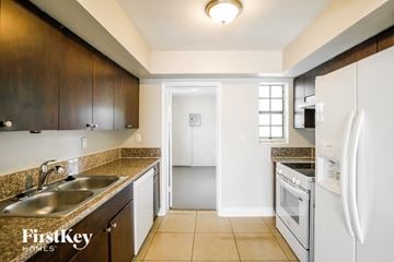 Hollywood house for rent - A kitchen with a sink, refrigerator, and oven.