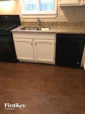 Aurora house for rent - a kitchen with a sink and a counter top