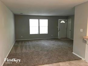 Stone Mountain house for rent - A room with a carpeted floor and a door.