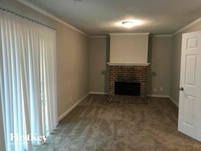 Stone Mountain house for rent - A room with a fireplace and a door.