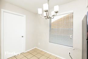 Arlington house for rent - a dining room with a window and a light fixture on the ceiling