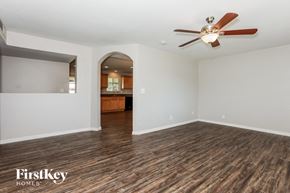 Mesa house for rent - a living room with white walls and a ceiling fan
