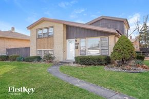 Oak Lawn house for rent - a brick house with a walkway in front of it