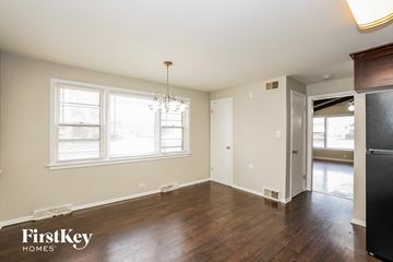 Oak Lawn house for rent - a kitchen and living room with wood flooring and a large window