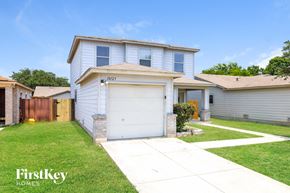 San Antonio house for rent - A white house with a garage is for sale by FirstKey Homes.