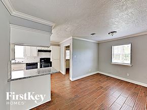 Conroe house for rent - the kitchen and living room of an empty house