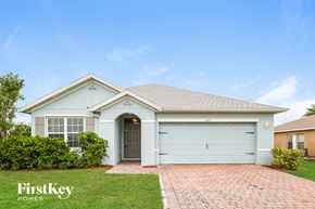Cape Coral house for rent - A house with a garage door numbered 101 is for sale.