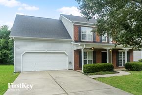 Indian Trail house for rent - a white and brick house with a white garage door