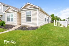Noblesville house for rent - a white house with a white fence in front of it