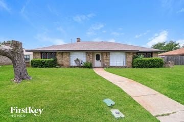 Desoto house for rent - a house with a lawn and a sidewalk in front of it